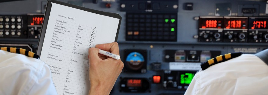 two pilots doing a pre-flight checklist